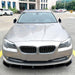 Black frontsplitter for BMW F10/F11 2010-2013 prefacelift installed on white sedan