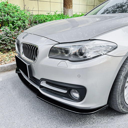 Black frontsplitter for BMW F10 F11 Facelift 2014-2017 LCI installed on white sedan