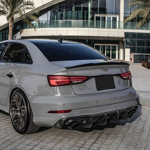 White Audi A3 8Y Sedan with glossy black rear spoiler and diffuser styling