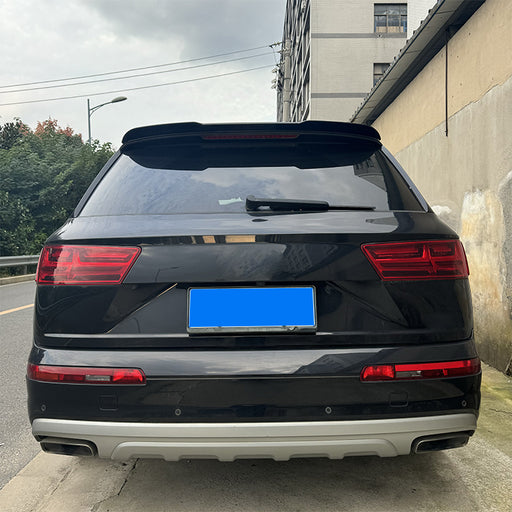 Black Audi Q7 4M SUV with matte black roof bag spoiler installed