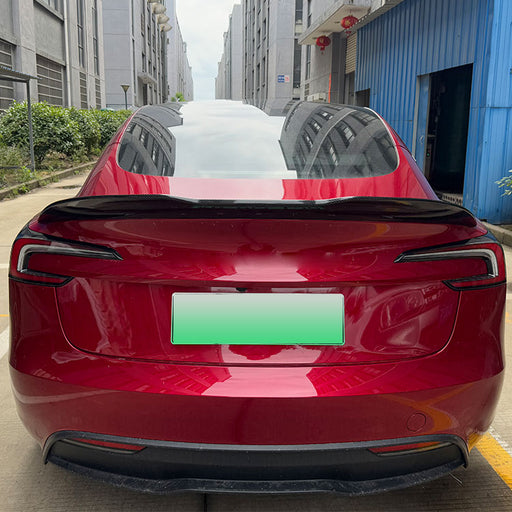 Black PSM style rear spoiler for Tesla Model 3 2023+ installed on red vehicle
