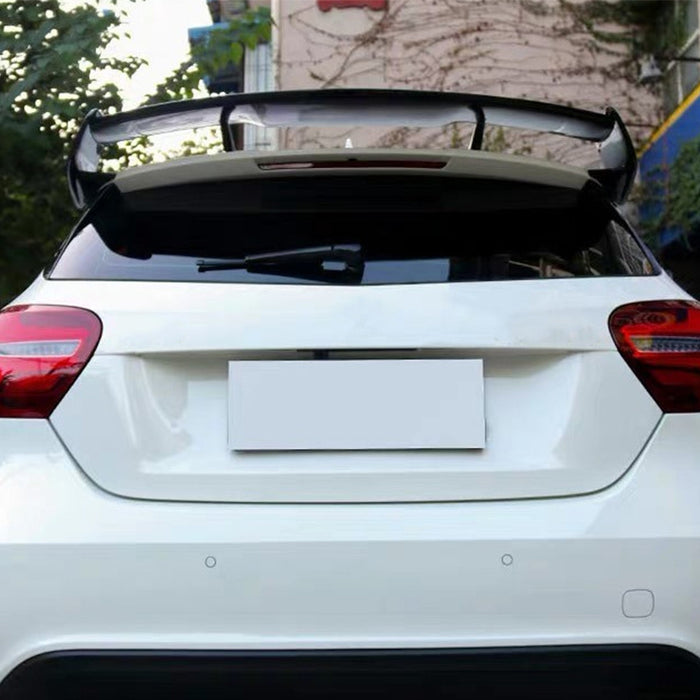 Black roof wing spoiler installed on white Mercedes-Benz A-Class W176 hatchback rear view