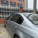 Silver BMW E90 with Bagrude black lameller cover window shade installed