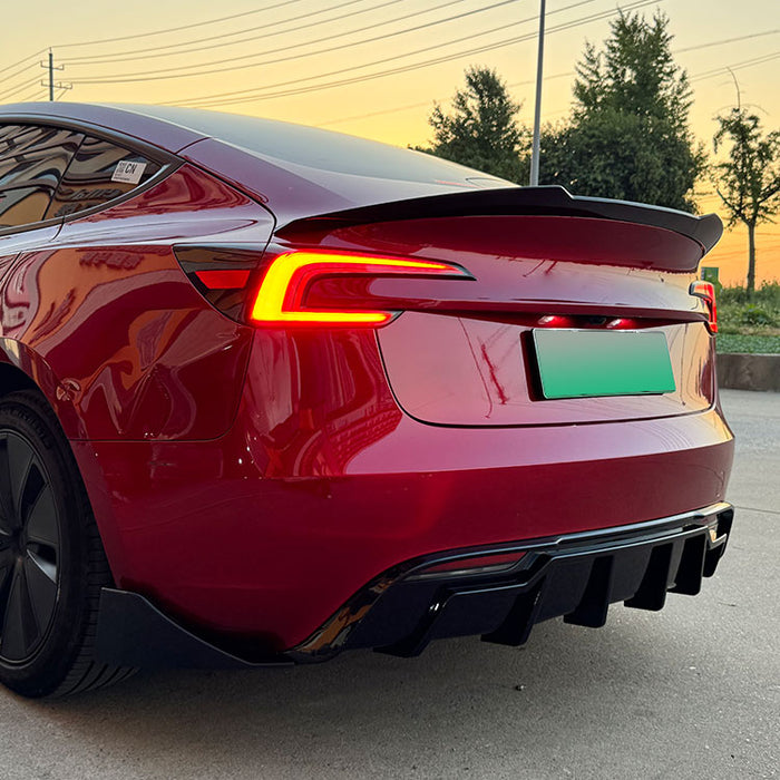 Gloss black rear bumper diffuser with side splitters for Tesla Model 3 2023 installed on vehicle