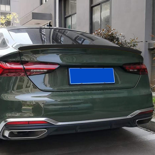 Black trunk lip spoiler for Audi A5 F5 sportsback installed on green sedan