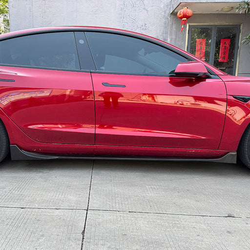 Black glossy aero side skirts installed on Tesla Model 3 2023+ sedan