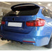 BMW 3-series F31 Touring with black gloss boot spoiler installed on blue estate car rear